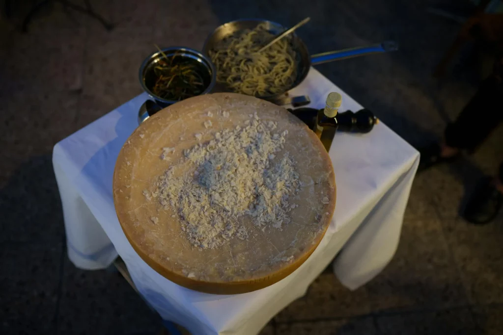 cheese wheel pasta on the table